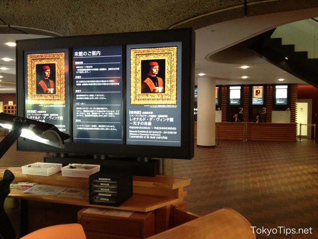 Display of information counter. Box-office windows are in back.